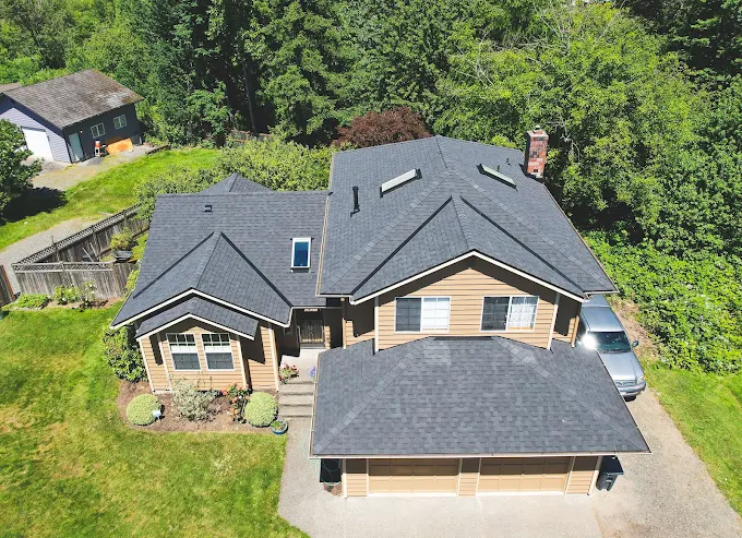Two-story Northwest home with a new charcoal shingle roof seen from above